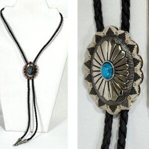 Silver-tone and turquoise-tone with black cord bolo tie.